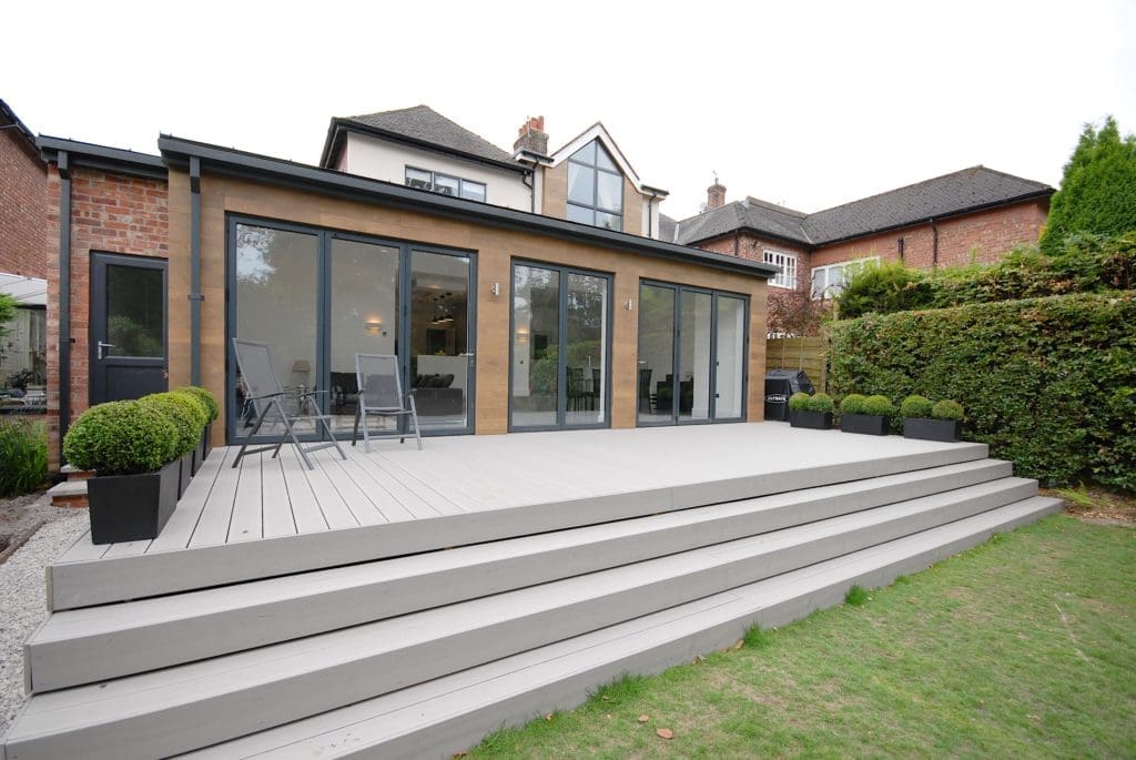a house with a deck and a patio.