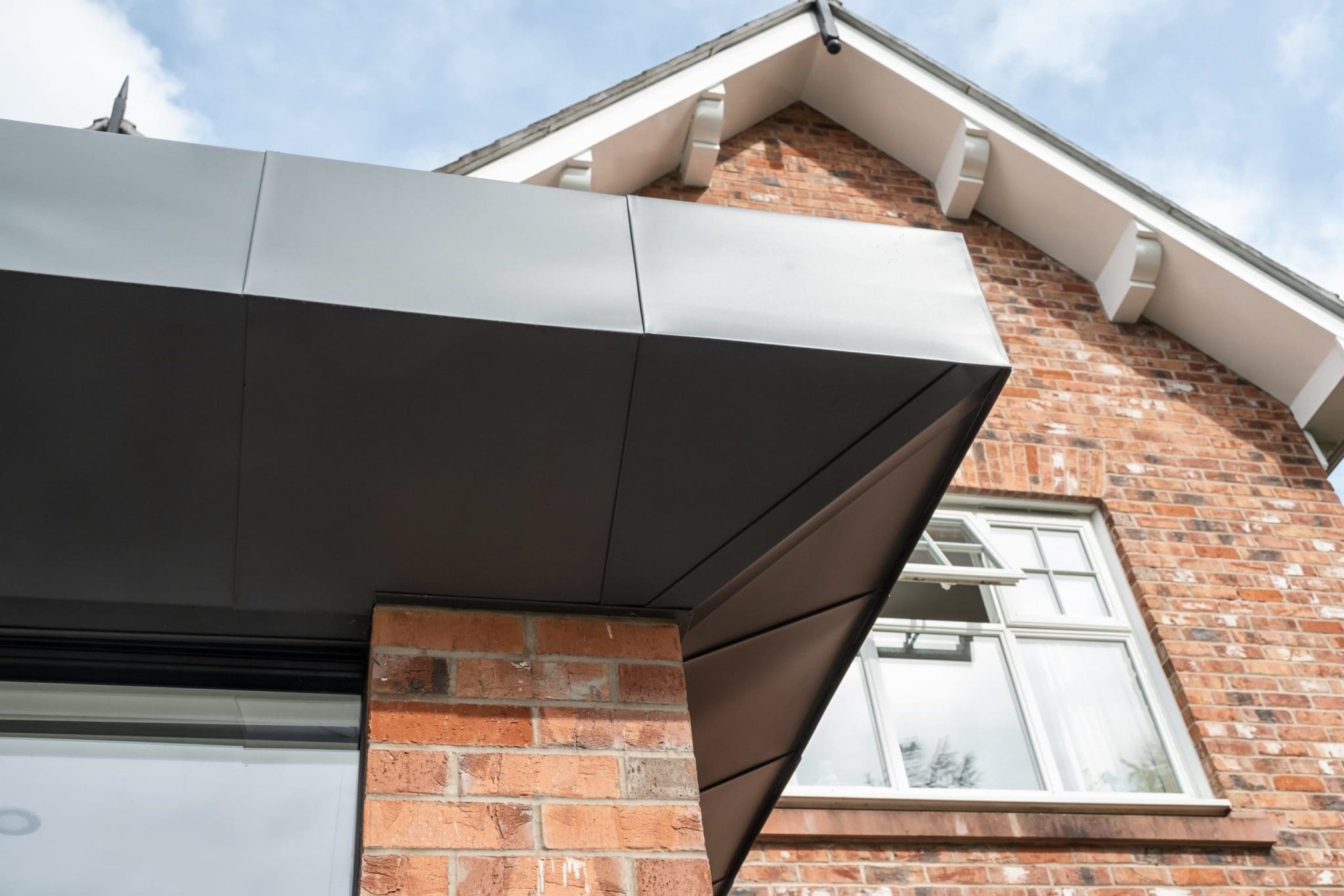 a close up of a brick building with a sky background.