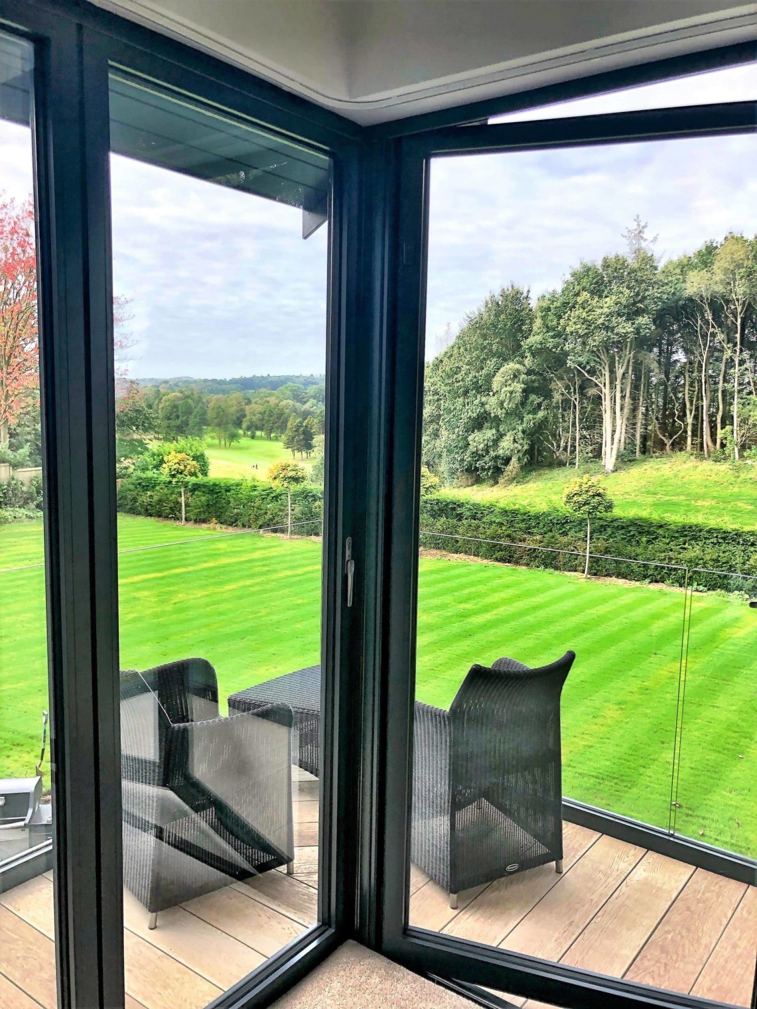 two chairs sitting on top of a hard wood floor.