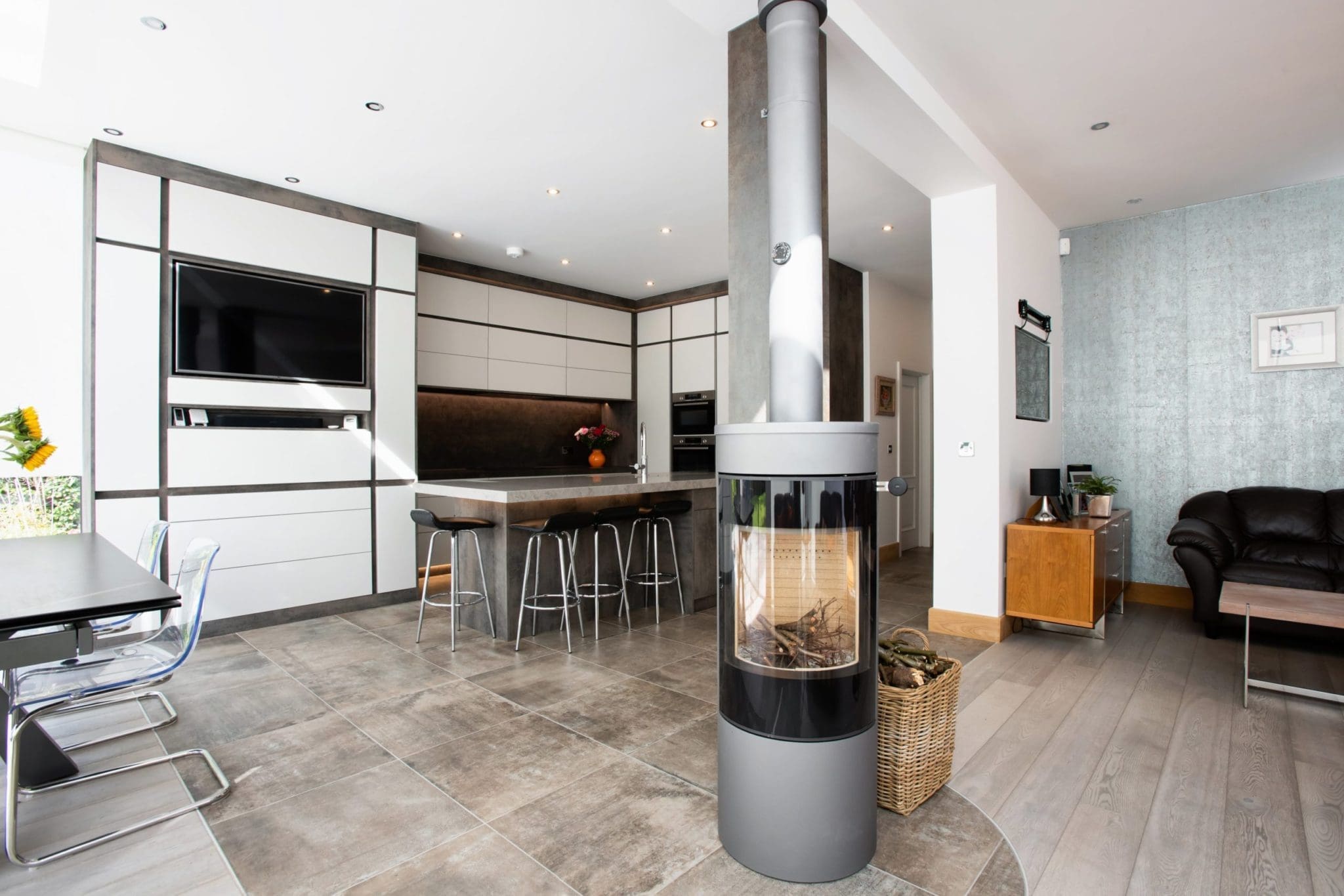 a living room with a couch a table and a fireplace.