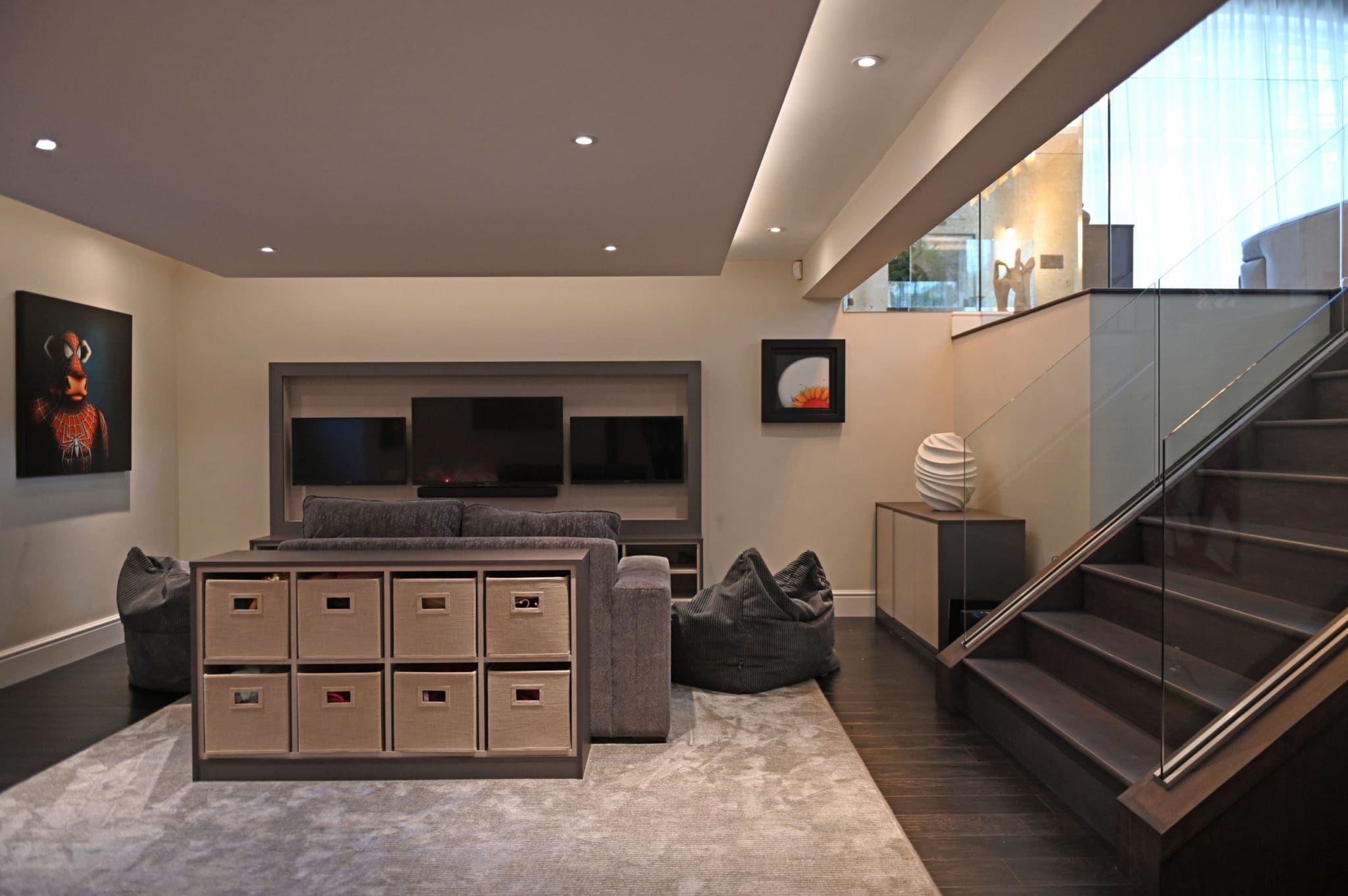 a living room filled with furniture and a stair case.
