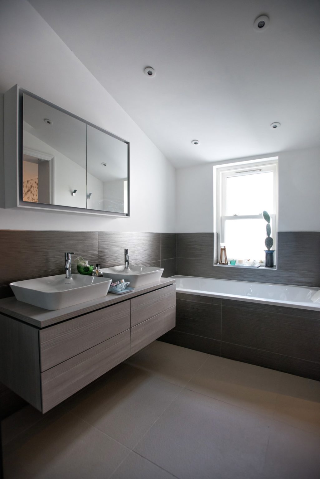 a bathroom with a sink and a bathtub.