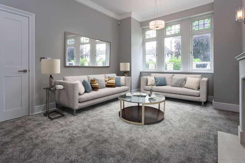 a living room filled with furniture and a fire place.