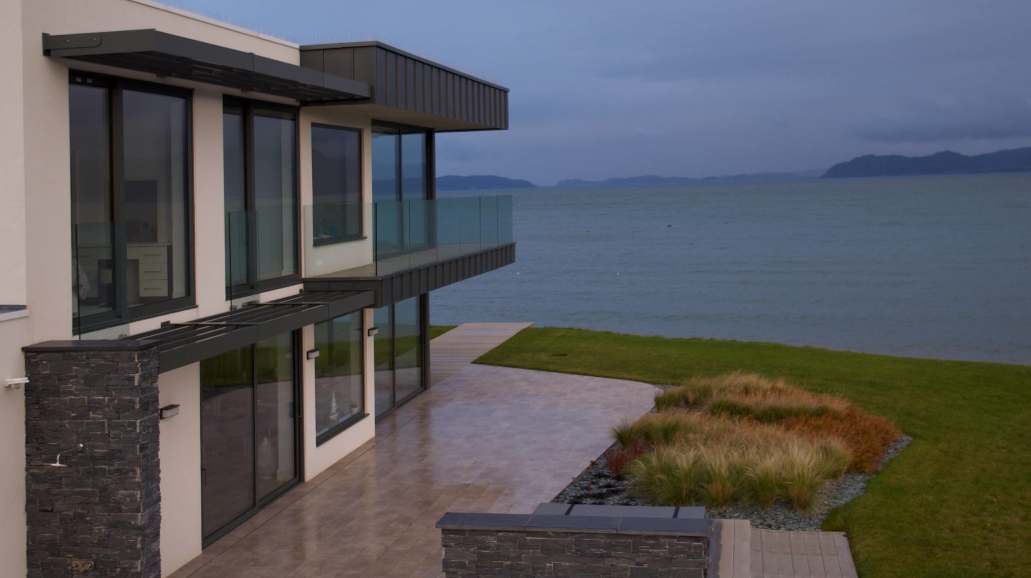 a house with a view of a body of water.