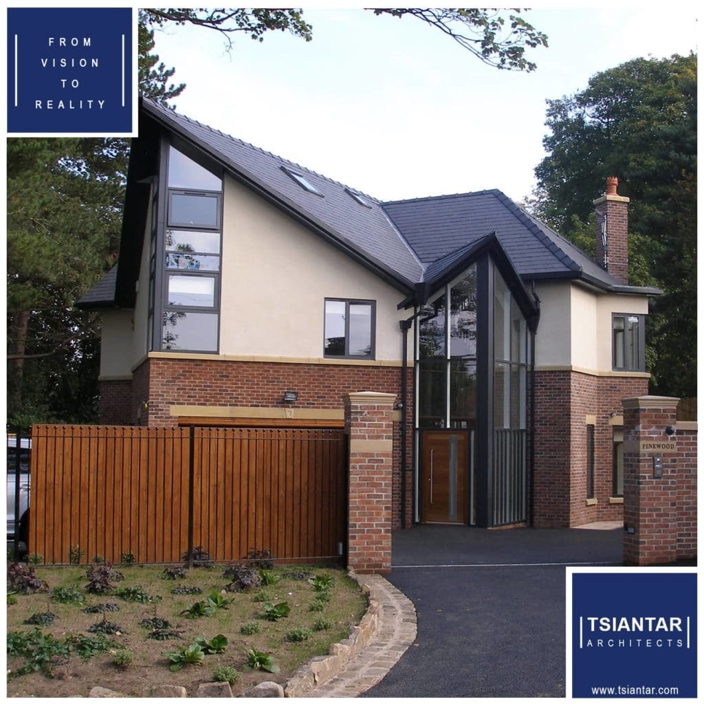 a large house with a wooden fence in front of it.
