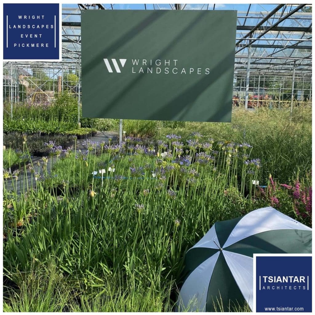 a greenhouse with an umbrella in front of it.