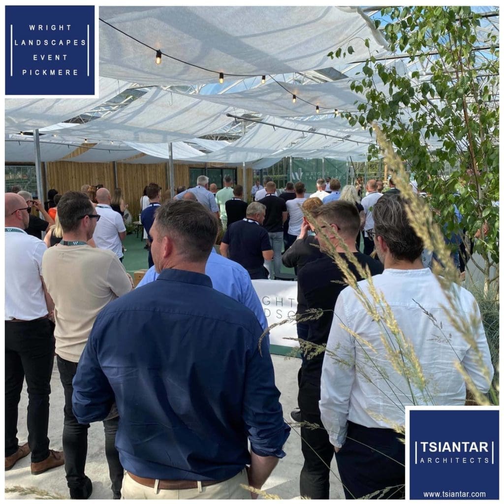 a group of people standing in front of a tent.