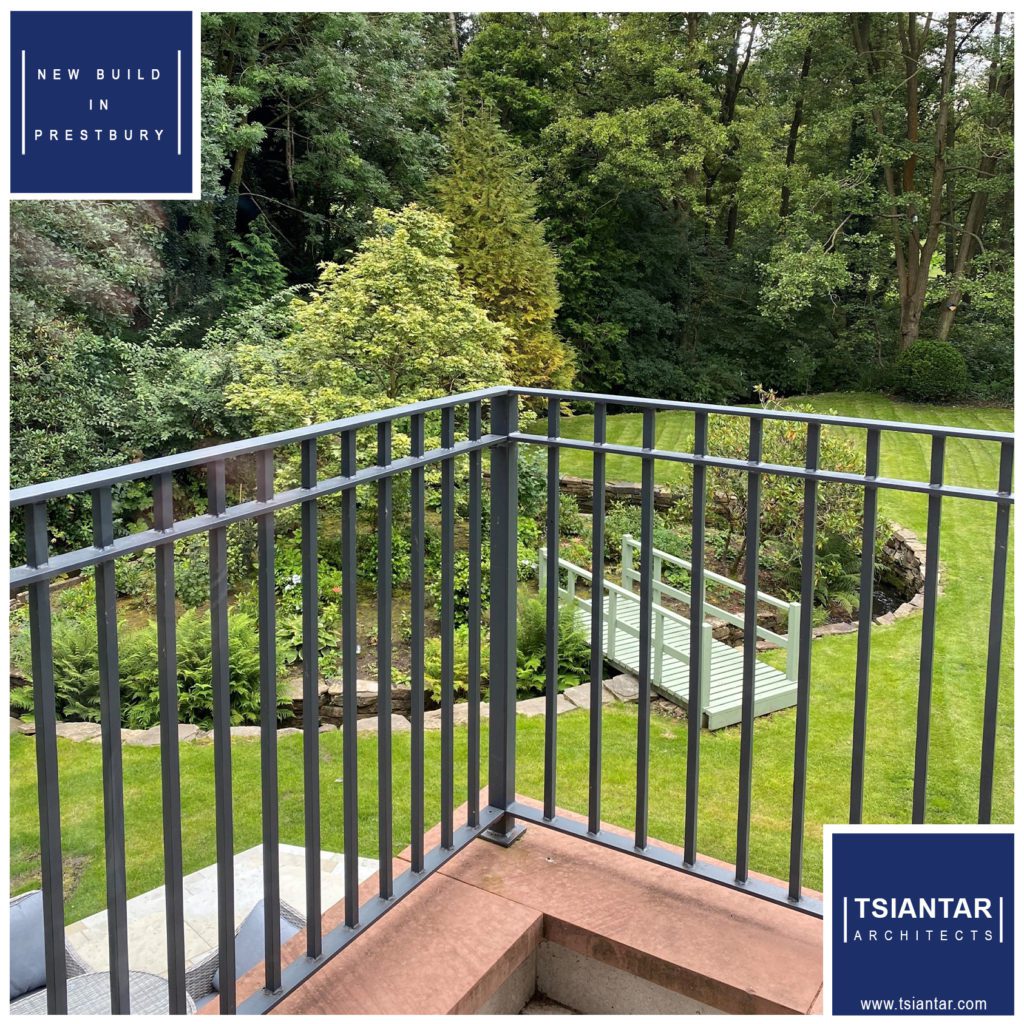 A CLOVERDALE garden features a wrought iron railing.