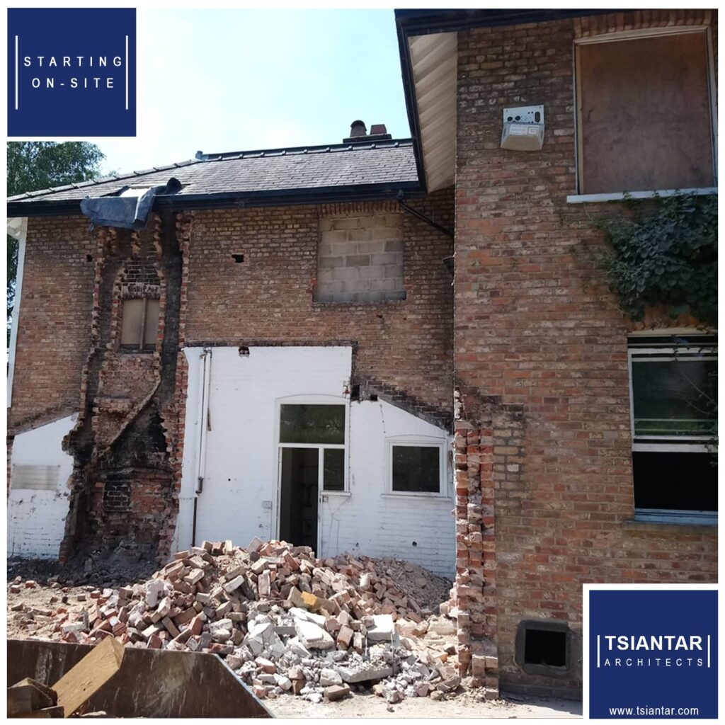 A house is undergoing transformation through demolition.