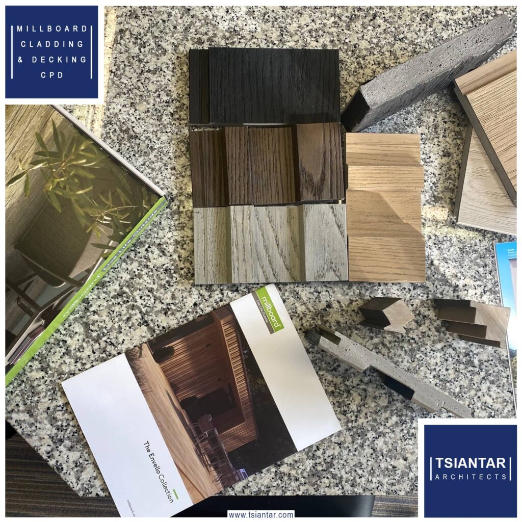 A table showcasing a range of flooring samples and brochures, including decking and millboard options.