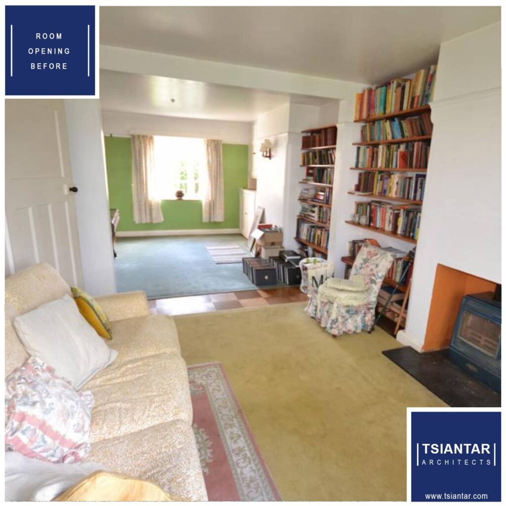 Living room before home renovation with bookshelves, a fireplace, and furniture.