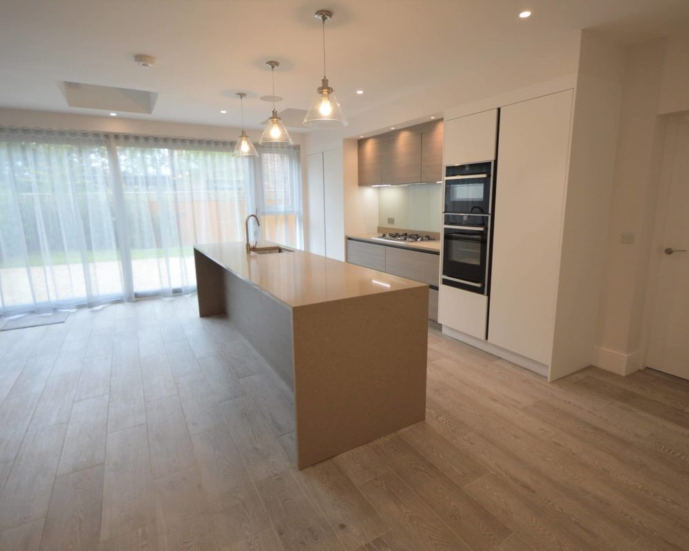 a kitchen with an island in the middle of the room.