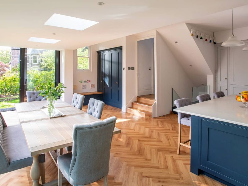 a kitchen with a table and chairs in it.